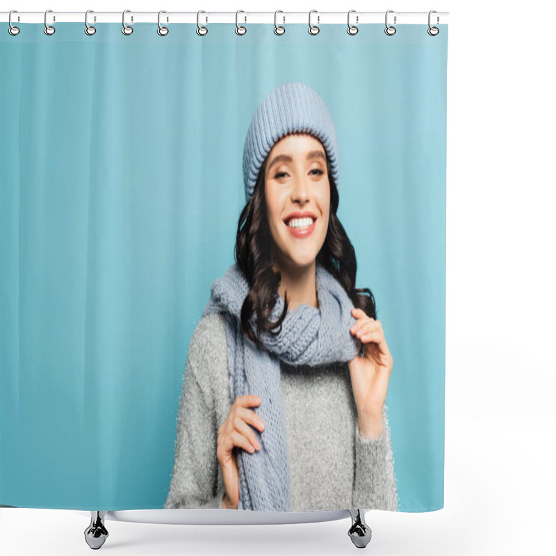 Personality  Happy Brunette Woman In Winter Outfit Touching Scarf While Looking At Camera Isolated On Blue Shower Curtains