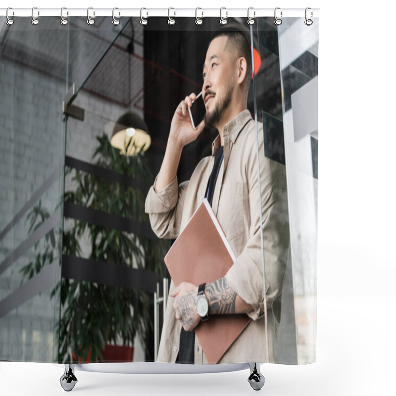 Personality  Happy Asian Businessman With Tattoo Holding Folder And Talking On Smartphone Near Glass Door Shower Curtains