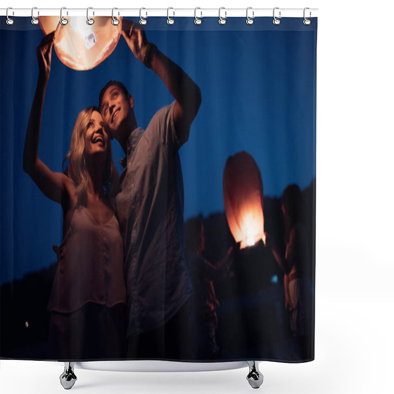 Personality  Young Couple Launching Sky Lantern On River Beach In Evening Shower Curtains