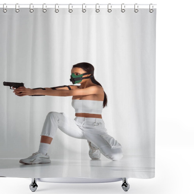 Personality  Futuristic African American Woman In Safety Mask Aiming Gun On White Background Shower Curtains