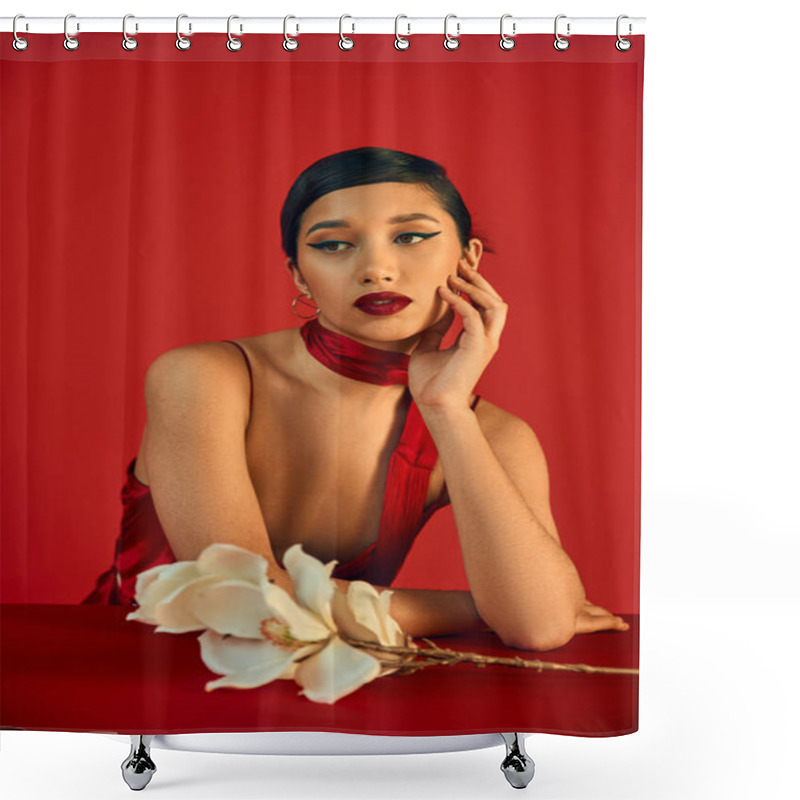 Personality  Dreamy Asian Woman With Brunette Hair And Bold Makeup Holding Hand Near Face And Looking Away Near White Orchid On Red Background, Spring Fashion, Strap Dress, Stylish Neckerchief Shower Curtains