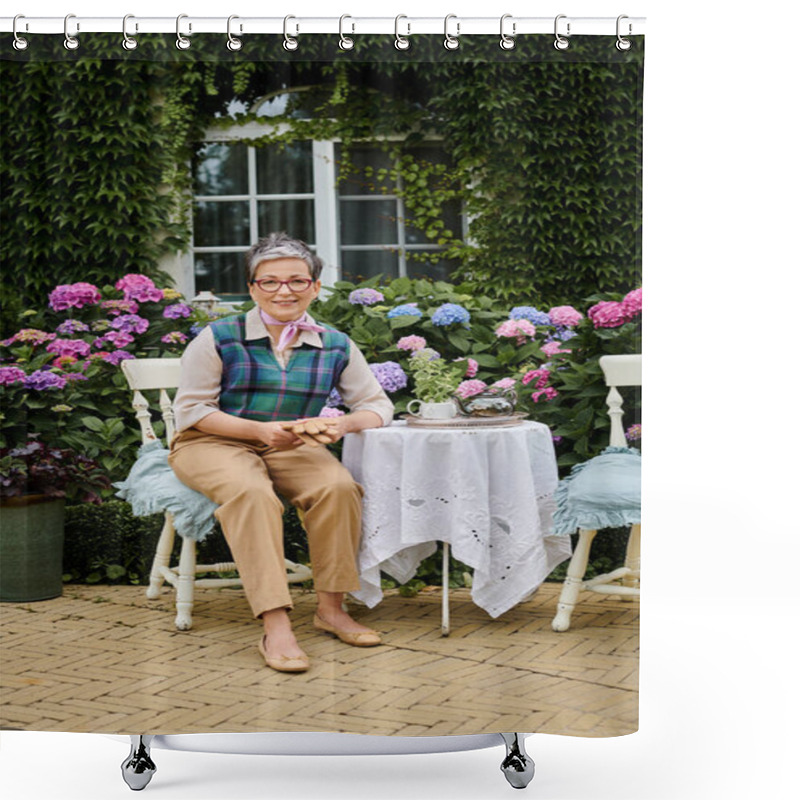 Personality  Cheerful Mature Woman Sitting In Garden At Tea Time Near House In England And Looking At Camera Shower Curtains