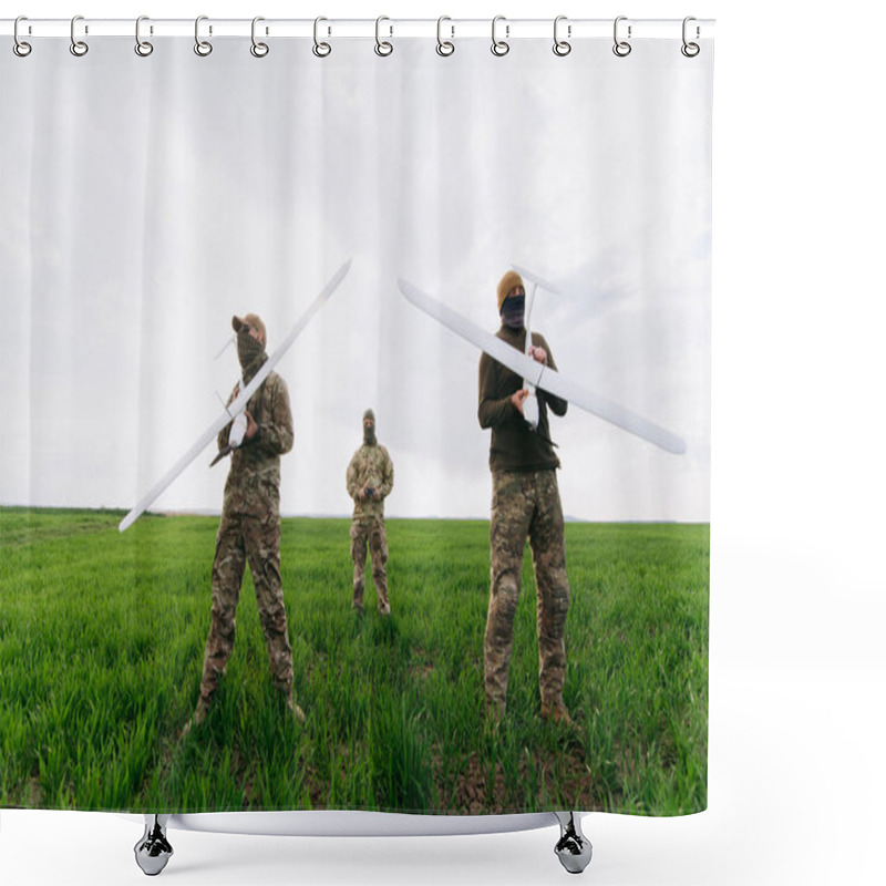 Personality  Three Military Personnel Stand In A Lush Field, Each Holding A Drone. They Exhibit Readiness For An Aerial Mission Under Overcast Sky Conditions. Shower Curtains