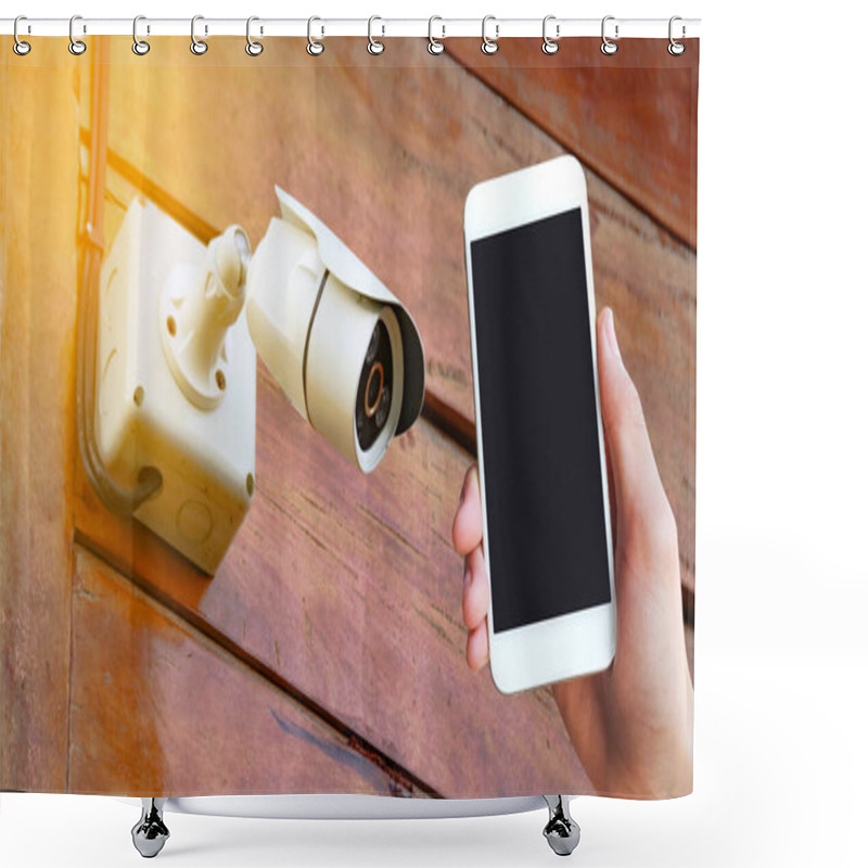 Personality  A Hand Holding A Mobile Phone Is Placed On A Picture Of A CCTV Camera At A Home. This Highlights The Integration Of Modern Technology In Home Security. Shower Curtains