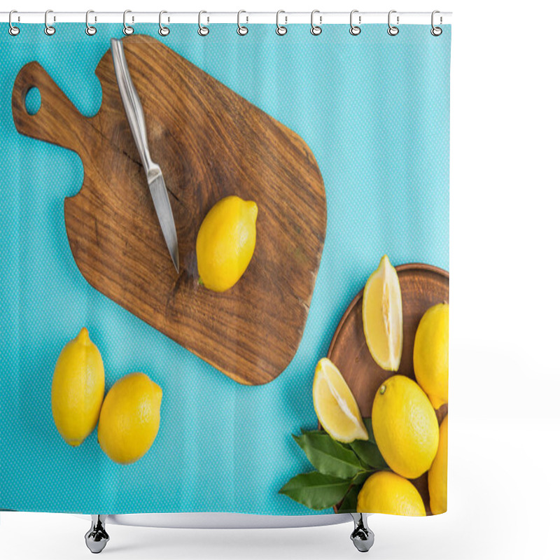 Personality  Top View Of Yellow Lemons With Knife On Wooden Cutting Board On Turquoise Background Shower Curtains