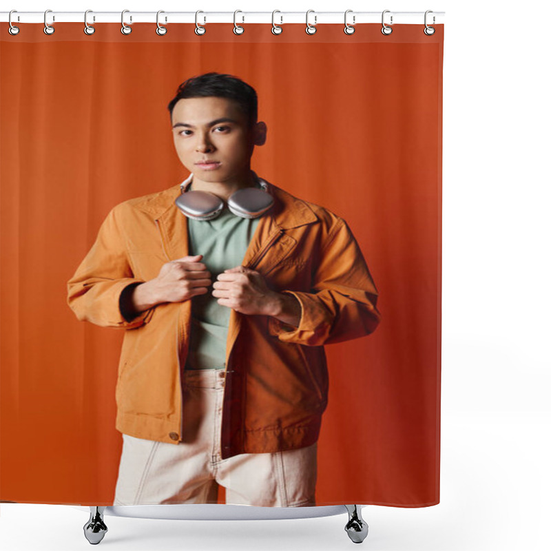 Personality  A Stylish Asian Man In An Orange Jacket And White Pants Striking A Confident Pose Against An Orange Backdrop In A Studio. Shower Curtains