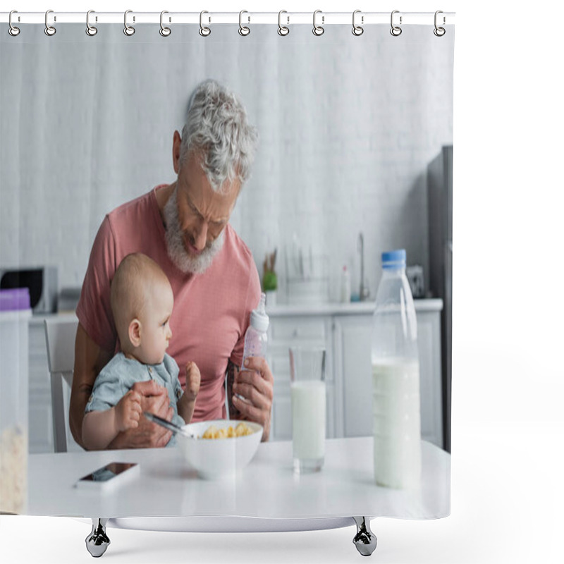 Personality  Mature Man Holding Baby Bottle Near Daughter And Breakfast In Kitchen  Shower Curtains