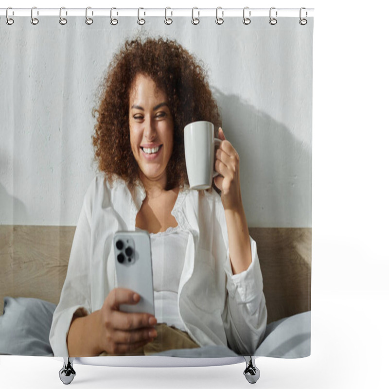 Personality  The Woman Smiles Brightly While Holding A Coffee Cup And Looking At Her Smartphone In Bed. Shower Curtains