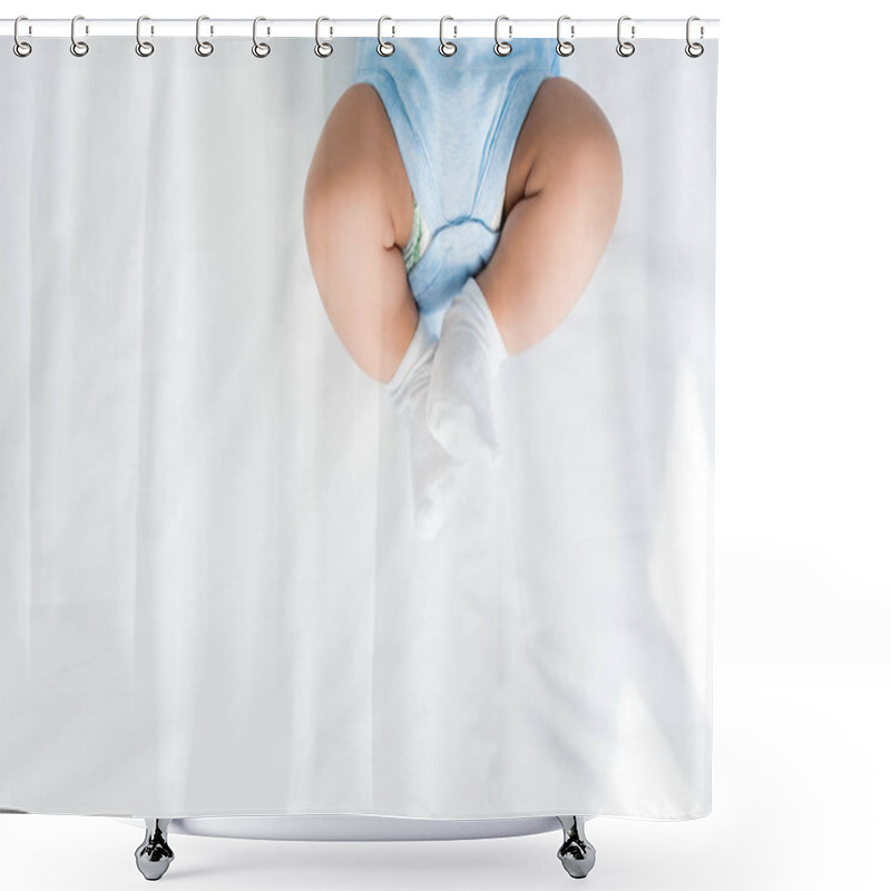 Personality  Cropped Shot Of Little Child In Rompers And White Socks Lying On Bed Shower Curtains