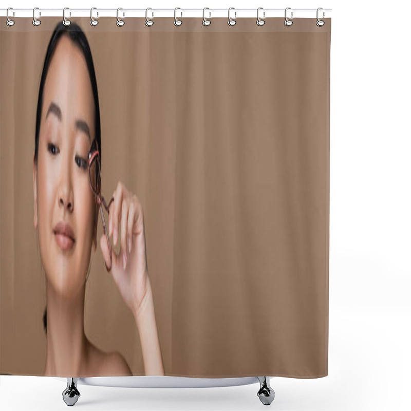 Personality  Pretty Asian Woman Holding Eyelash Curler Isolated On Brown With Copy Space, Banner  Shower Curtains