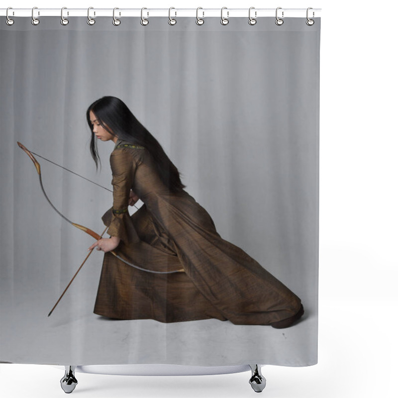 Personality  Close Up  Portrait Of Beautiful Young Asian Woman With Long Hair Wearing Medieval Fantasy Gown. Graceful Pose Holding A Long Bow And Arrow,  Isolated On Studio Background. Shower Curtains