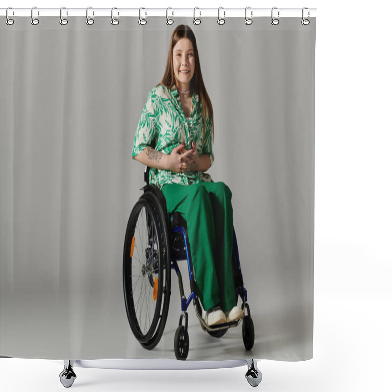 Personality  A Young Woman In A Green Shirt And Pants Sits In A Wheelchair Against A Grey Background, Smiling Confidently At The Camera. Shower Curtains