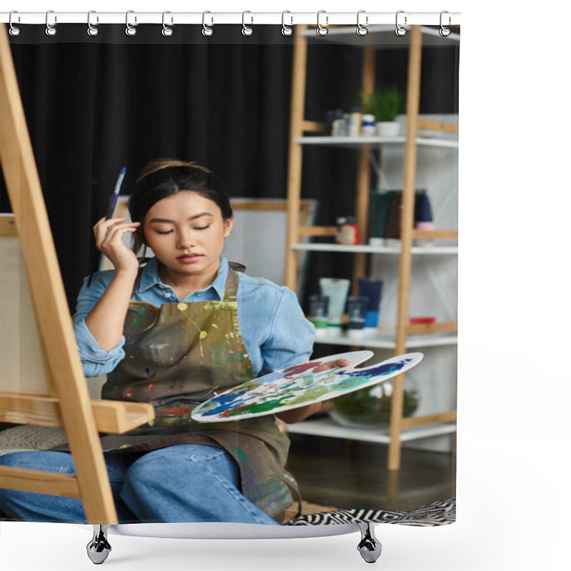 Personality  A Young Asian Woman Sits In Her Art Studio, Holding A Paintbrush And Palette, Focused On Her Artwork. Shower Curtains