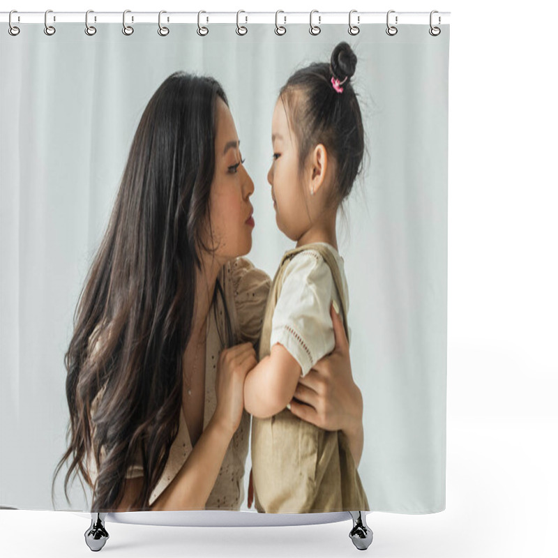 Personality  Side View Of Stylish Asian Mother Hugging Toddler Daughter Isolated On Grey Shower Curtains