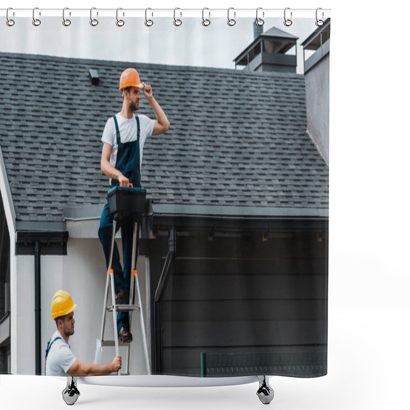 Personality  Handsome Repairman Sitting On Roof And Holding Toolbox Near Coworker In Helmet  Shower Curtains