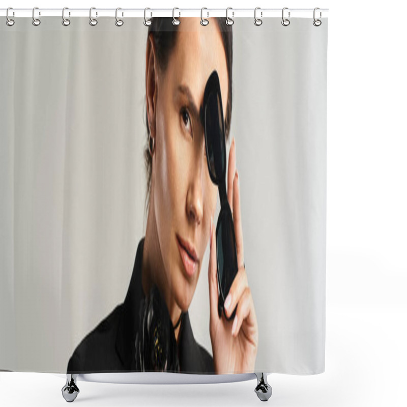 Personality  A Stylish Woman In A Suit Confidently Holds A Pair Of Black Sunglasses In A Studio Setting On Grey Shower Curtains