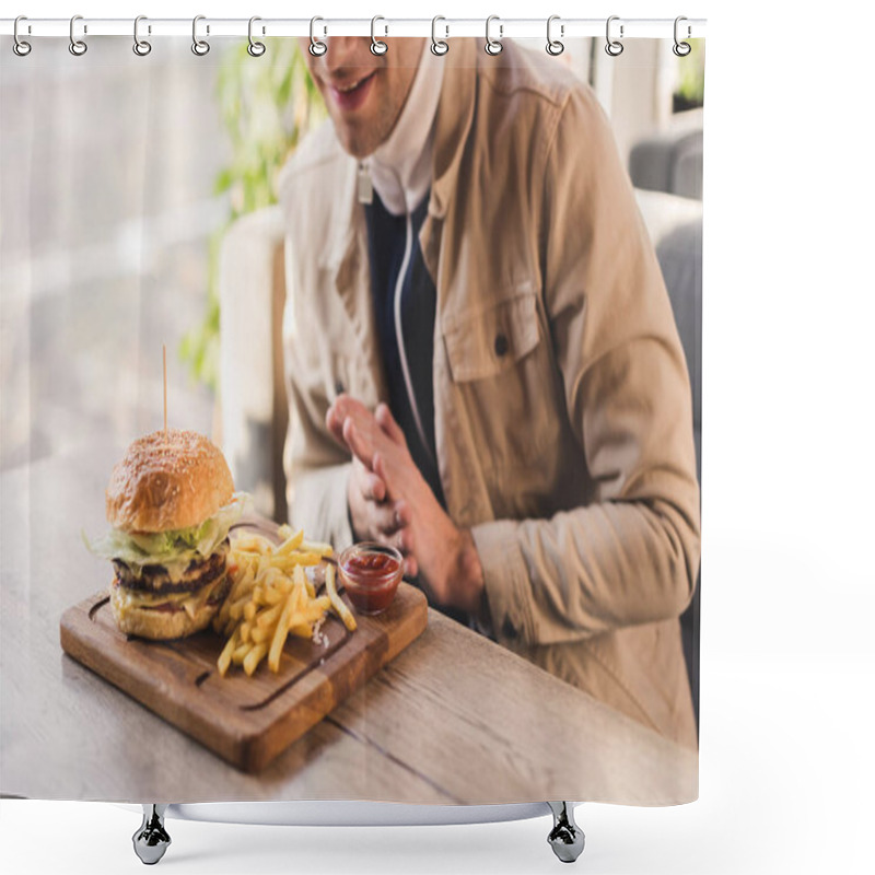 Personality  Cropped View Of Cheerful Man Looking At Tasty Burger And French Fries On Cutting Board In Cafe Shower Curtains