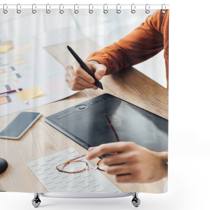 Personality  Selective Focus Of Ux Designer Holding Eyeglasses While Using Graphics Tablet Near Smartphone And Layouts On Table Shower Curtains