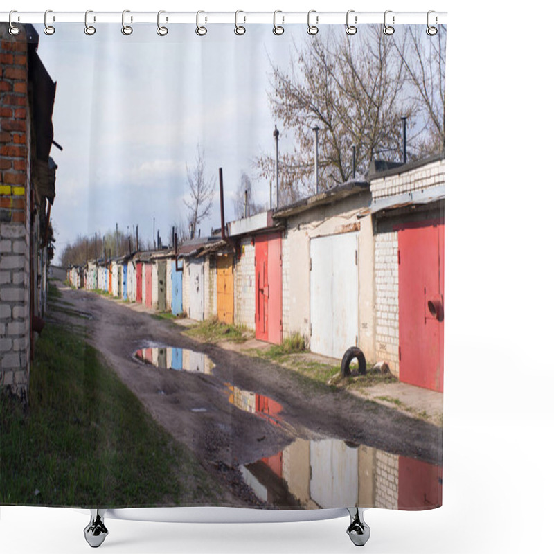 Personality  Brick Garages With Bright Metal Doors In The City On A Spring Day With Puddles On The Road After Rain. Garage Cooperative Shower Curtains