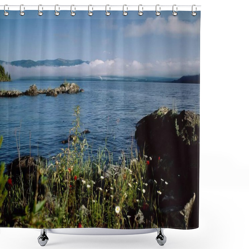 Personality  Serene Azure Waterscape: Vibrant Flowers And Lush Vegetation Under A Cloudy Sky Shower Curtains