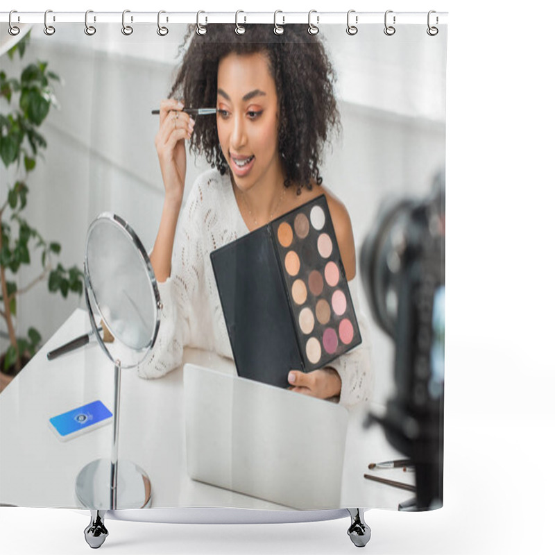 Personality  KYIV, UKRAINE - DECEMBER 10, 2019: Selective Focus Of African American Influencer In Braces Applying Eye Shadow Near Smartphone With Shazam App On Screen  Shower Curtains