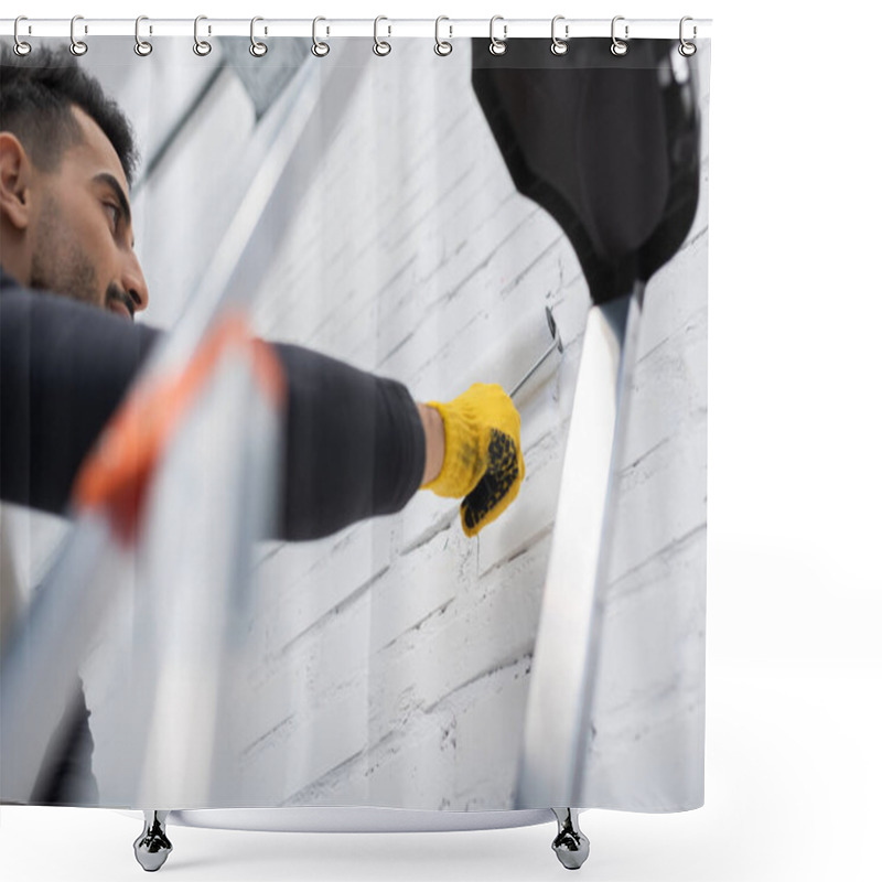 Personality  Low Angle View Of Muslim Man Painting Brick Wall Near Blurred Ladder At Home Shower Curtains