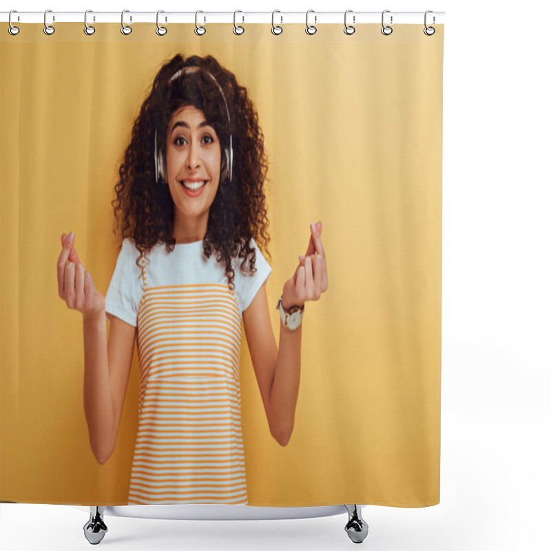 Personality  Excited Mixed Race Girl In Wireless Headphones Showing Winner Gesture On Yellow Background Shower Curtains