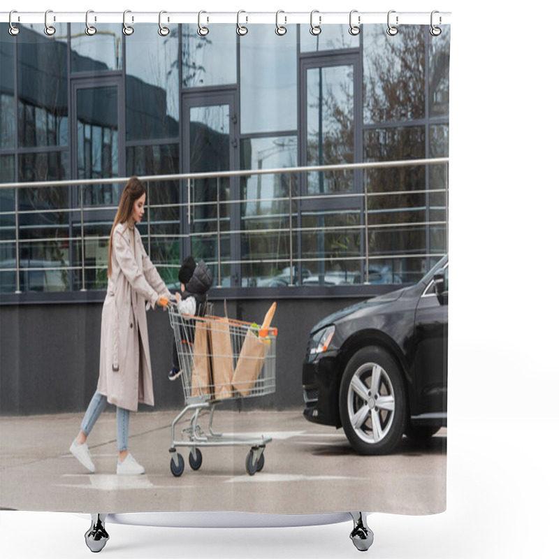 Personality  Young Woman With Son And Purchases In Shopping Cart Walking Towards Car Shower Curtains