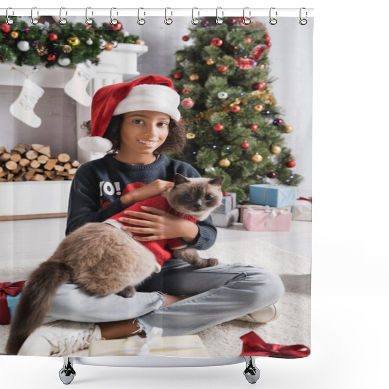 Personality  Happy African American Girl Smiling At Camera While Cuddling Cat Near Christmas Tree On Blurred Background Shower Curtains