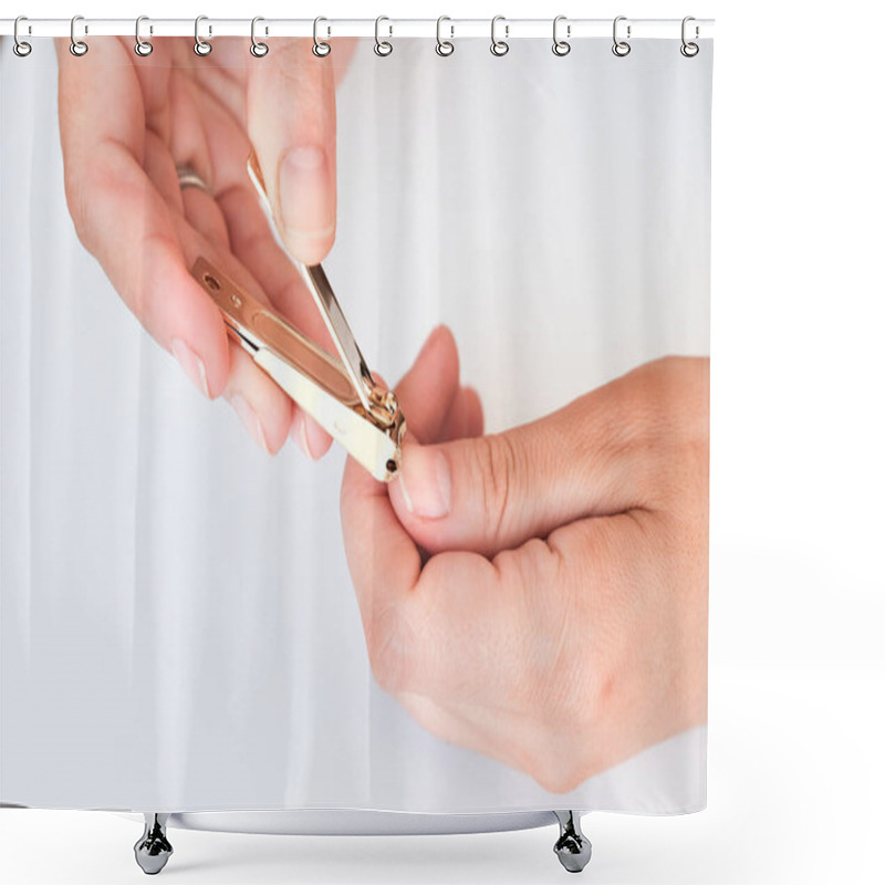 Personality  Woman Hands Using A Nail Clippers To Cut Her Fingernails On A White Background. View From Above. Manicure At Home. Shower Curtains