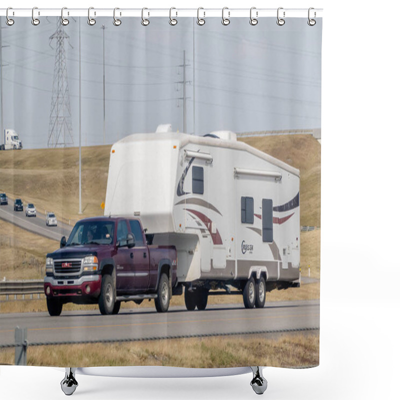 Personality  Calgary, Alberta, Canada. Aug 12, 2024. A Maroon GMC Sierra HD Truck Towing A White Fifth-wheel RV Labeled 