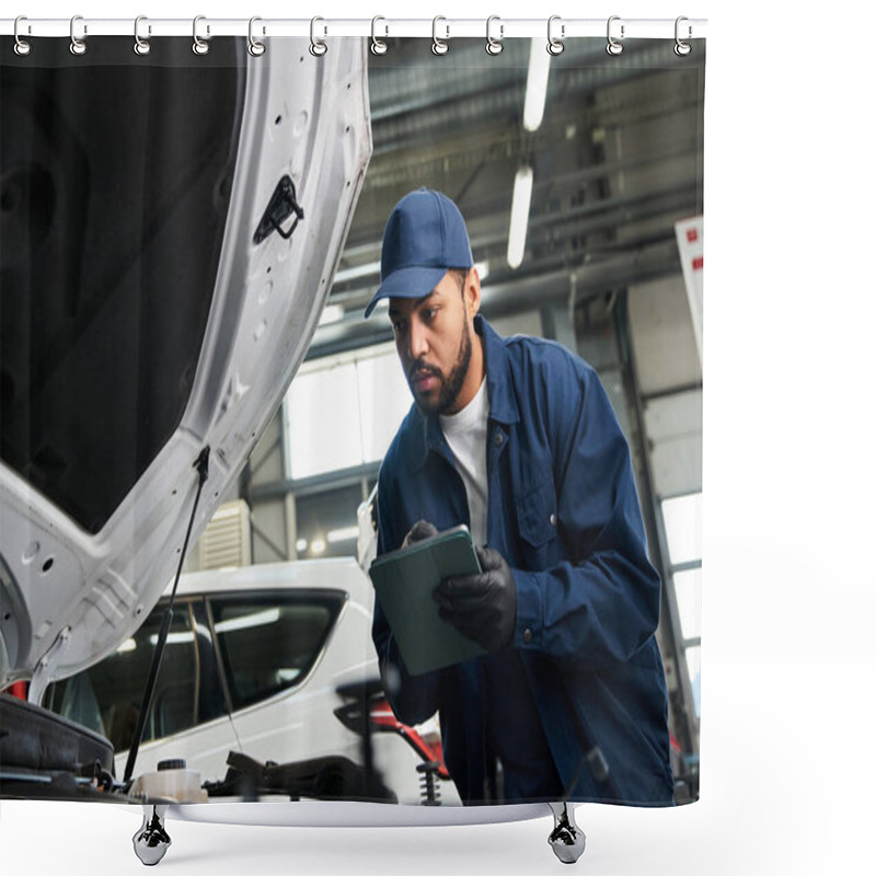 Personality  A Focused Young Mechanic Inspects A Car Engine While Taking Notes In A Busy Auto Repair Shop. Shower Curtains