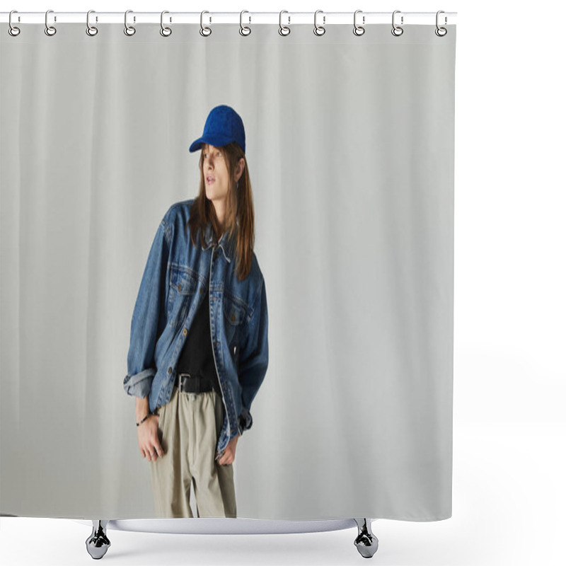 Personality  A Stylish Young Man Poses In Trendy Clothes And A Cap Against A Plain Backdrop. Shower Curtains