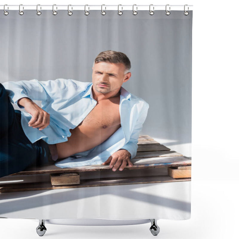 Personality  Handsome Adult Man Lying On Wooden Pallet On White And Looking Away Shower Curtains