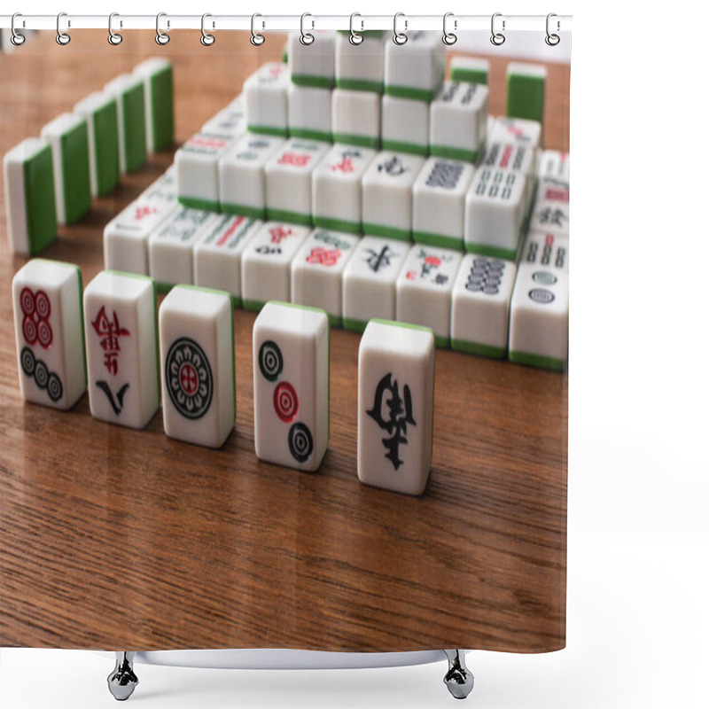 Personality  KYIV, UKRAINE - JANUARY 30, 2019: Selective Focus Of Rows And Pyramid Made Of Mahjong Game Tiles On Wooden Table Shower Curtains