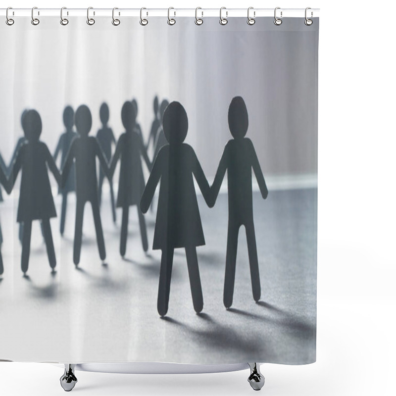 Personality  Black Paper Figure Of A Couple In Front Of A Crowd Of Paper People Holding Hands On White Surface. Social Movement, Leadership, Protest Concept. Shower Curtains