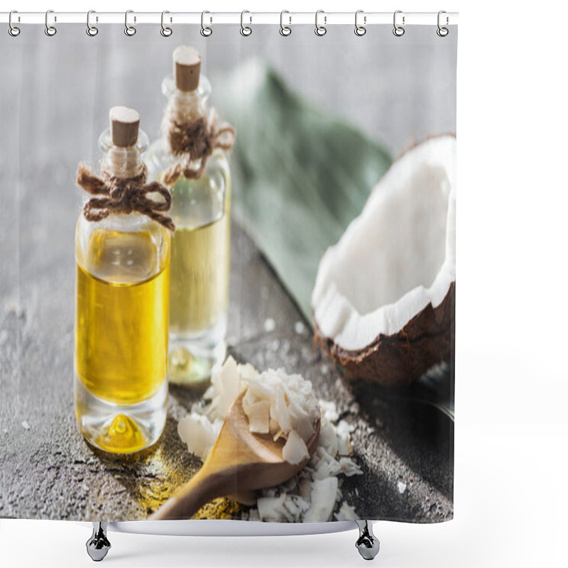 Personality  Selective Focus Of Bottles With Coconut Oil Near Coconut Half And Shavings In Wooden Spoon On Grey Background Shower Curtains