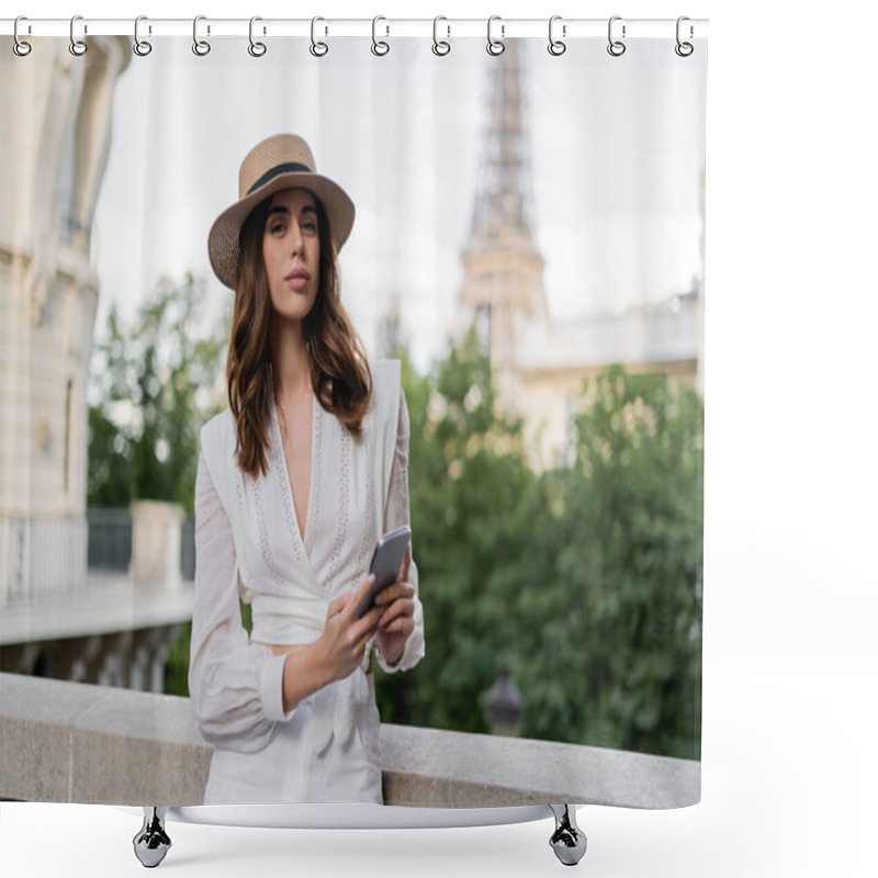 Personality  Stylish Woman In Sun Hat Holding Smartphone And Looking At Camera With Eiffel Tower At Background In Paris  Shower Curtains