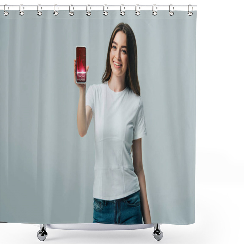 Personality  Happy Beautiful Girl In White T-shirt Showing Smartphone With Trading Courses App Isolated On Grey Shower Curtains