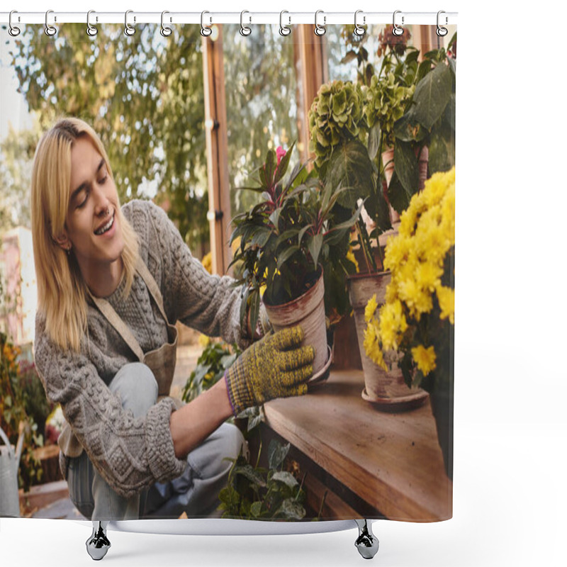 Personality  A Young And Handsome Man With Blond Hair Smiles While Tending To Colorful Plants In A Greenhouse. Sunlight Fills The Space, Creating A Warm And Inviting Atmosphere For Gardening. Shower Curtains