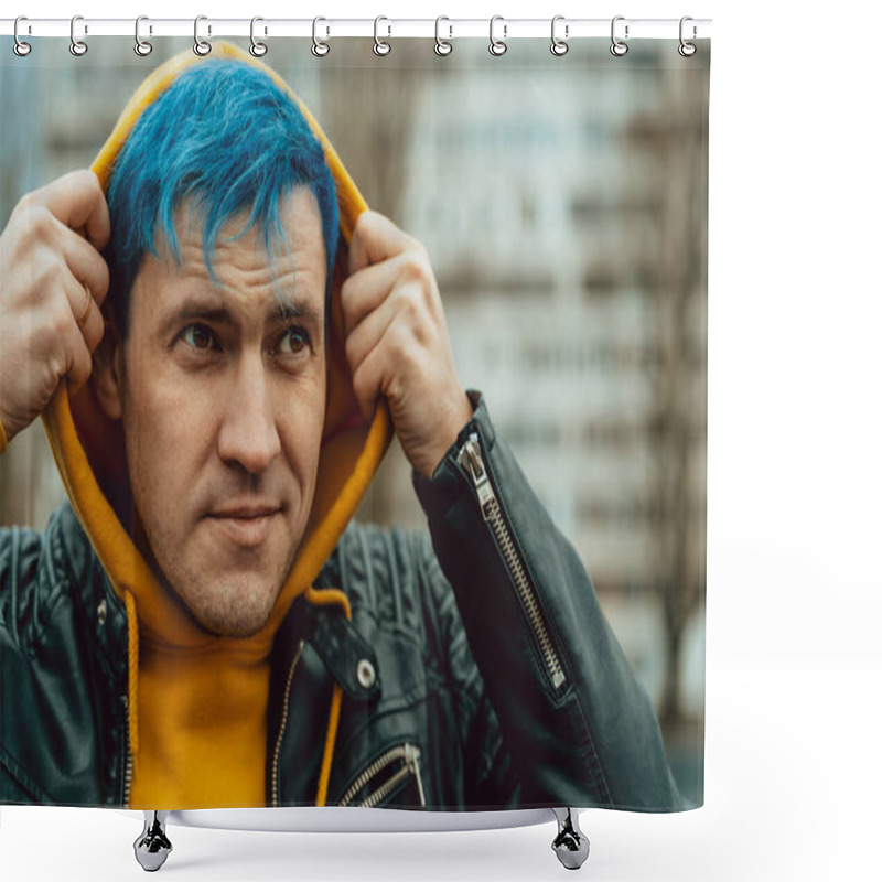 Personality  Portrait Of Young Man In Hood On Background Of High-rise Building. Handsome Guy With Blue Hair Posing On City Street In Springtime Shower Curtains