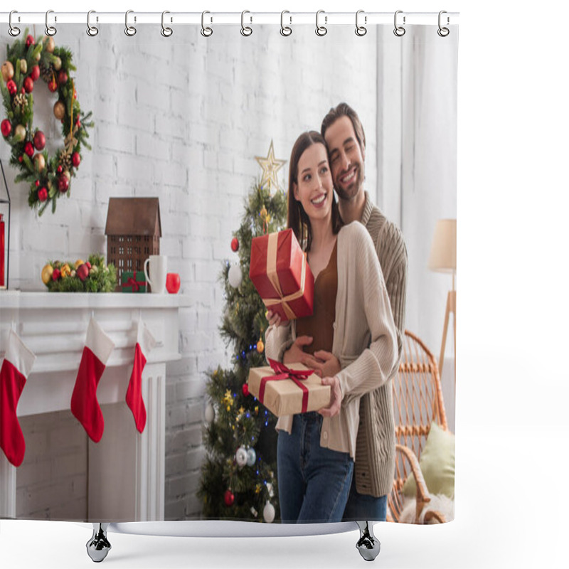 Personality  Happy Man Embracing Wife Holding Gift Boxes Near Christmas Tree And Decorated Fireplace Shower Curtains