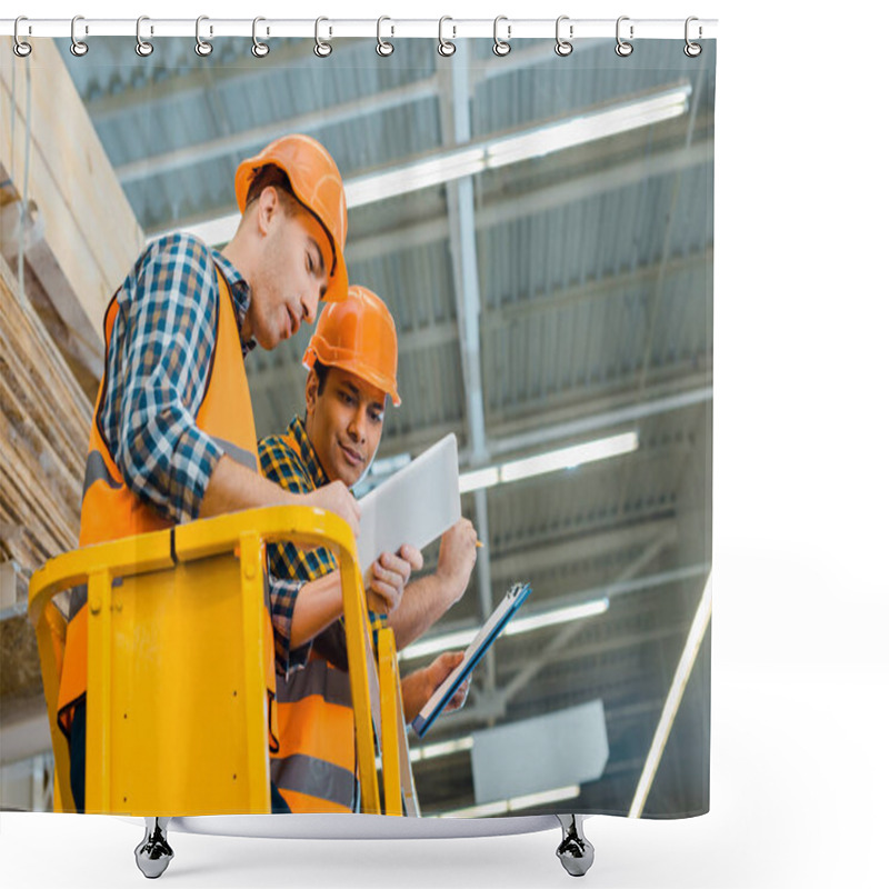 Personality  Concentrated Multicultural Workers Using Digital Tablet While Standing On Scissor Lift Shower Curtains