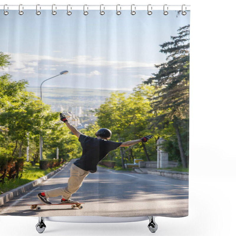 Personality  A Young Guy Action Makes A Stand-up Slide On A Longboard In The Resort Area Of The City Shower Curtains