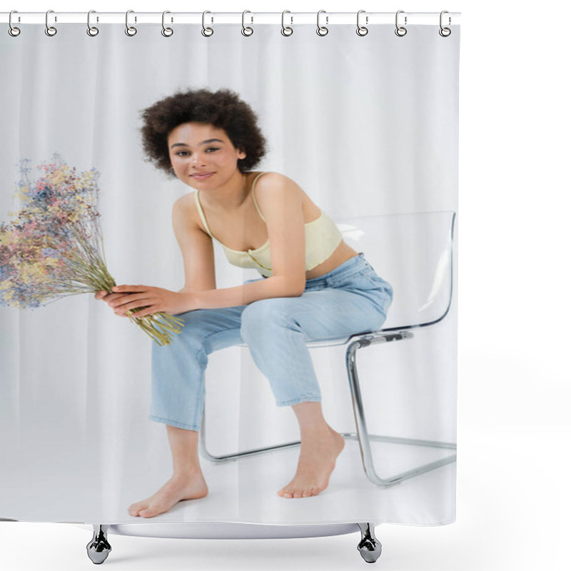 Personality  Barefoot Woman In Pants And Top Holding Flowers While Sitting On Chair On Grey Background  Shower Curtains