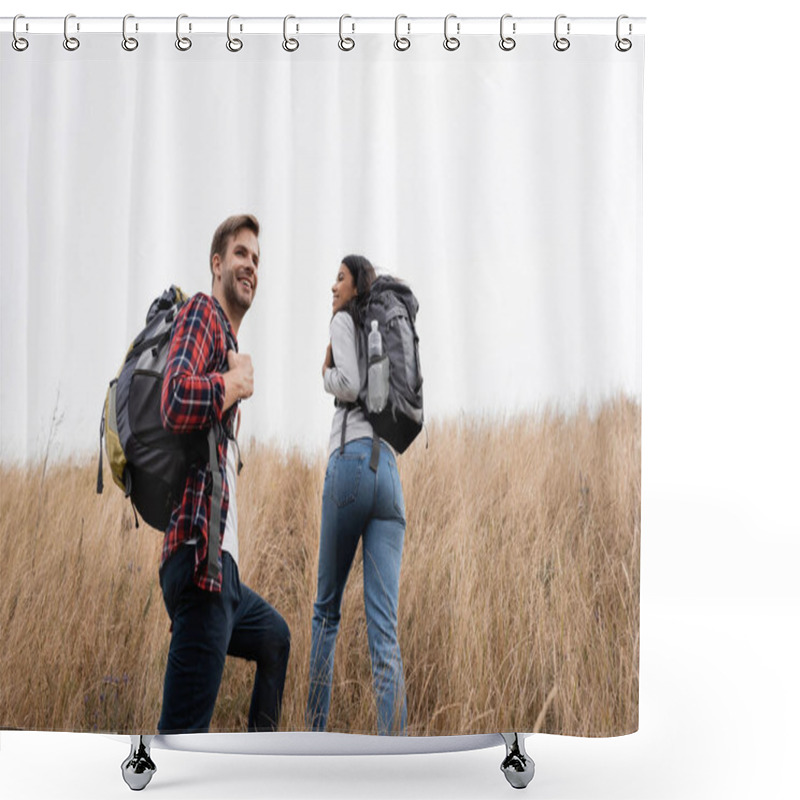 Personality  Young Hiker Smiling Near African American Girlfriend Walking On Grassy Hill  Shower Curtains