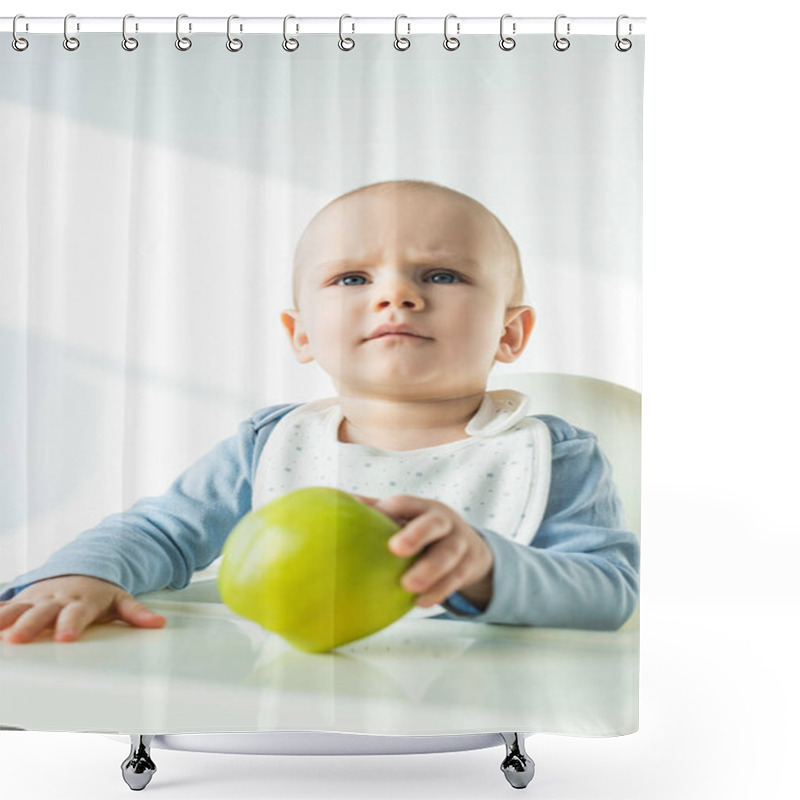 Personality  Selective Focus Of Pensive Baby Boy Holding Green Apple While Sitting On Feeding Chair On White Background Shower Curtains