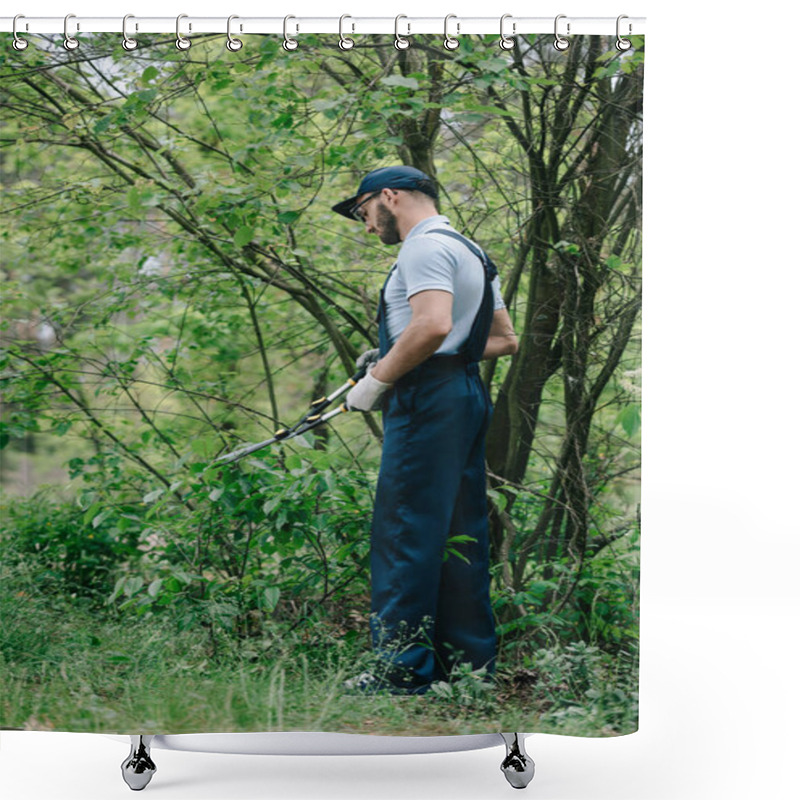 Personality  Gardener In Overalls And Cap Cutting Bushes With Trimmer In Garden Shower Curtains