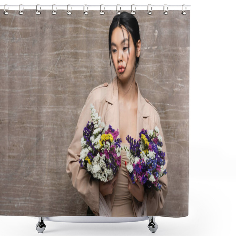 Personality  Pretty Asian Model In Beige Trench Coat Holding Wildflowers On Abstract Brown Background Shower Curtains