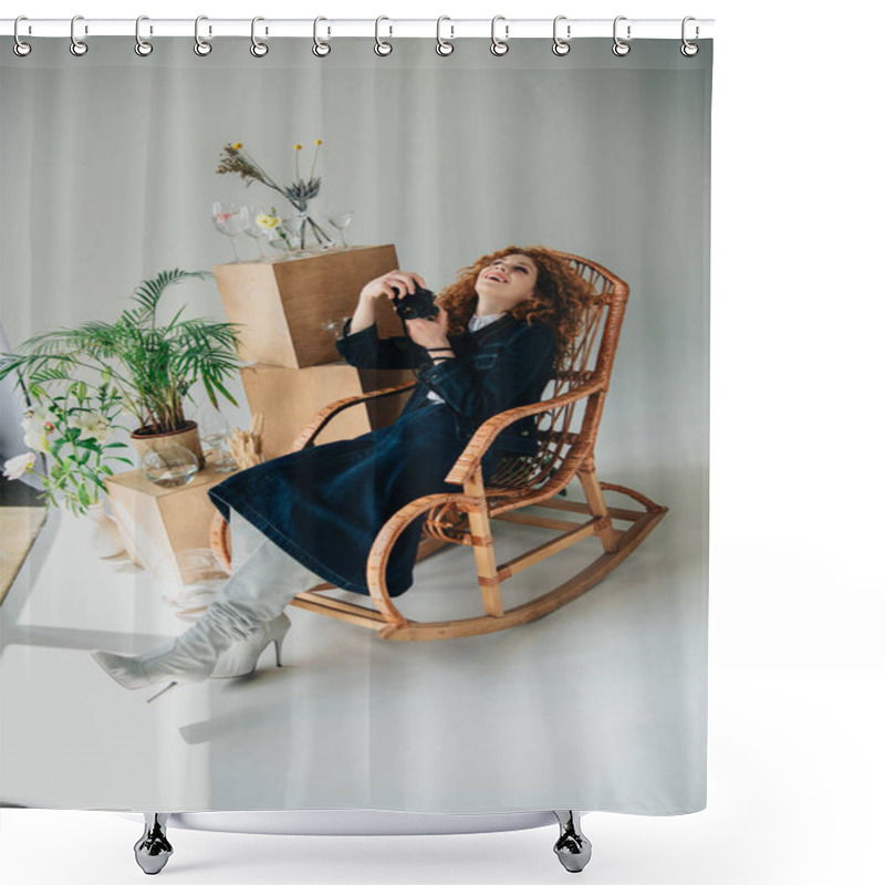 Personality  Stylish Laughing Girl In Wicker Chair With Film Camera Near Wooden Boxes, Glasses And Plants On Grey Shower Curtains